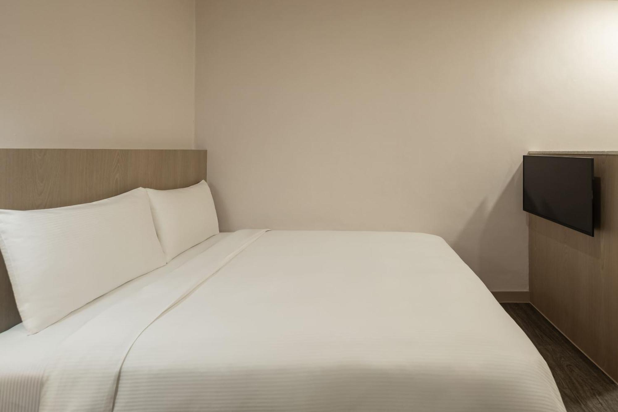 Kindness Hotel - Tainan Minsheng Номер фото